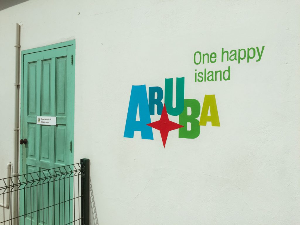 The island's slogan, "One happy island"