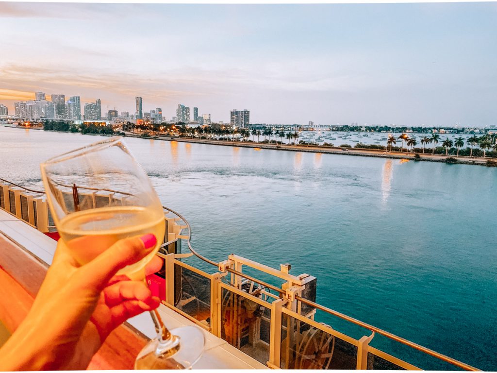 Enjoying a glass of wine while sailing out of Miami, Florida